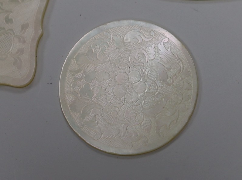 Approximately 135 Chinese carved mother of pearl counters of varying shapes, 19th century